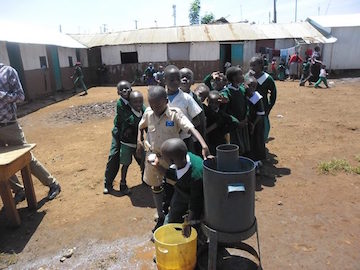 compassion students line up for hand washing