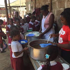 serving lunch at Lizpal School