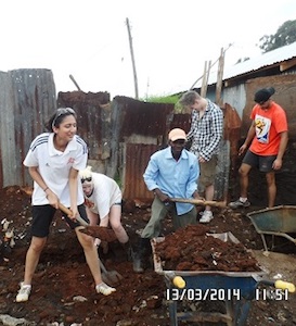 volunteers digging drains at Excel